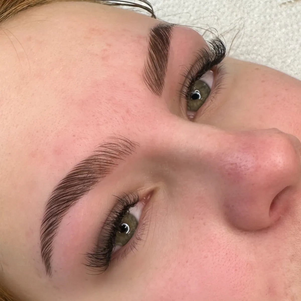 Image showcasing the Brow Lamination technique at Crystal Cosmetics Gold Coast. The visual highlights the transformation that gives brows a fuller, uniform look, perfect for taming unruly brows or achieving a trendy brushed-up appearance. The technique enhances brow fullness and thickness for up to 6 weeks.