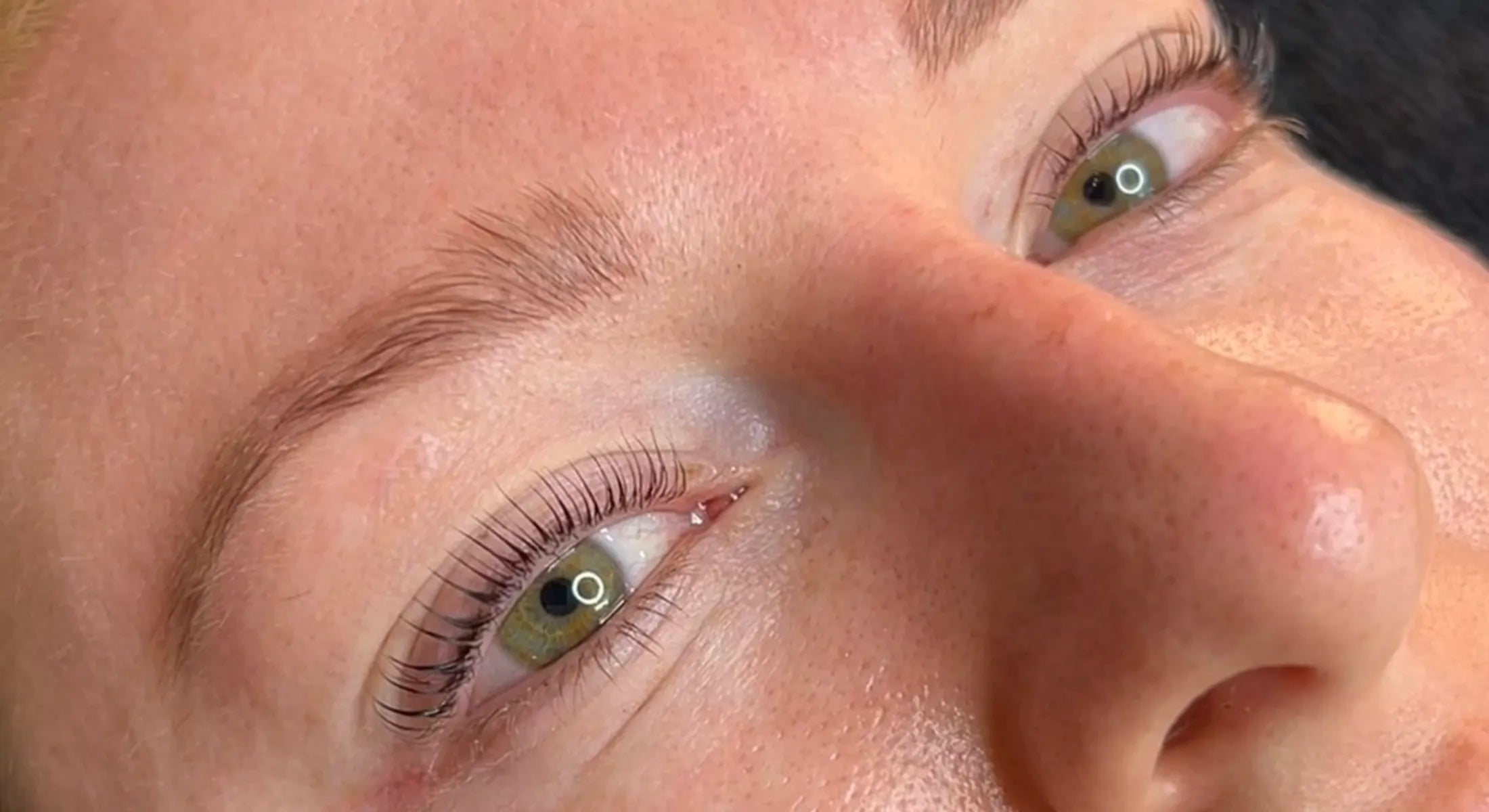 Image showing a before-and-after comparison of a lash lift procedure at Crystal Cosmetics Gold Coast. The 'before' side displays the natural lashes, while the 'after' side reveals perfectly curled and tinted lashes, demonstrating the expertise of the lash experts in crafting the ideal look.